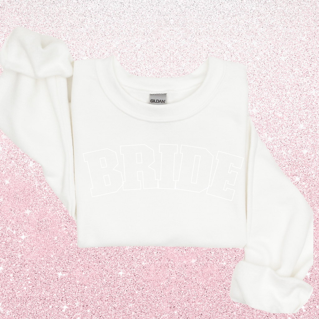 A white sweater with "BRIDE" in white 