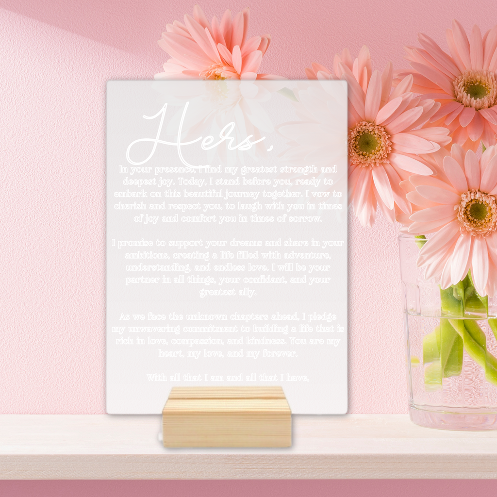 an acrylic poster with "hers" vows engraved