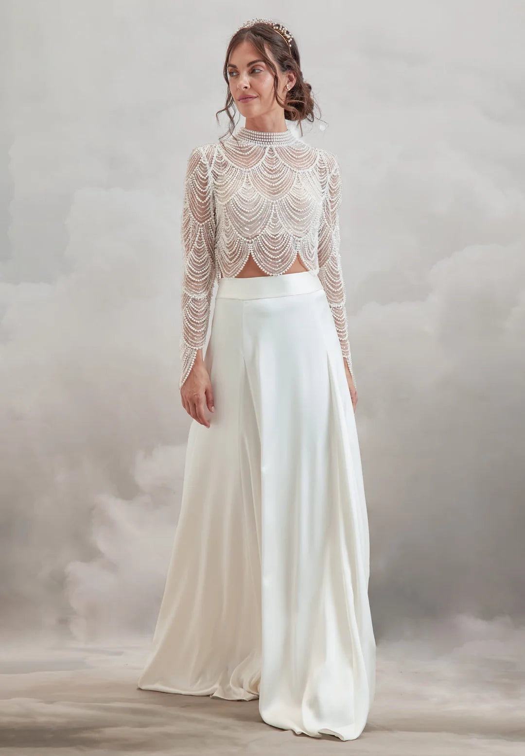 Brooklyn Skirt from Catherine Deane on a model. The thick waistband on this A-line skirt is shown with the matching anya beaded topper