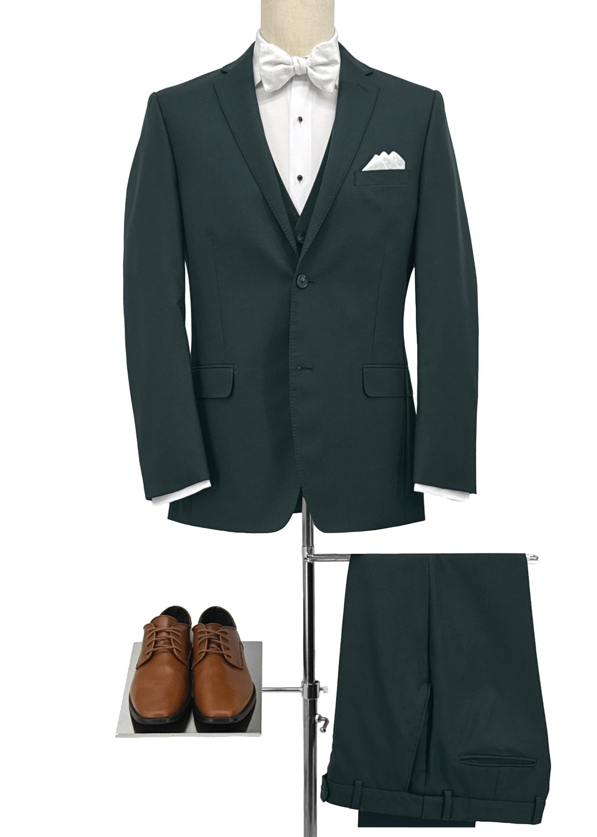 Green suit with white shirt, bow tie, and brown shoes on a white background
