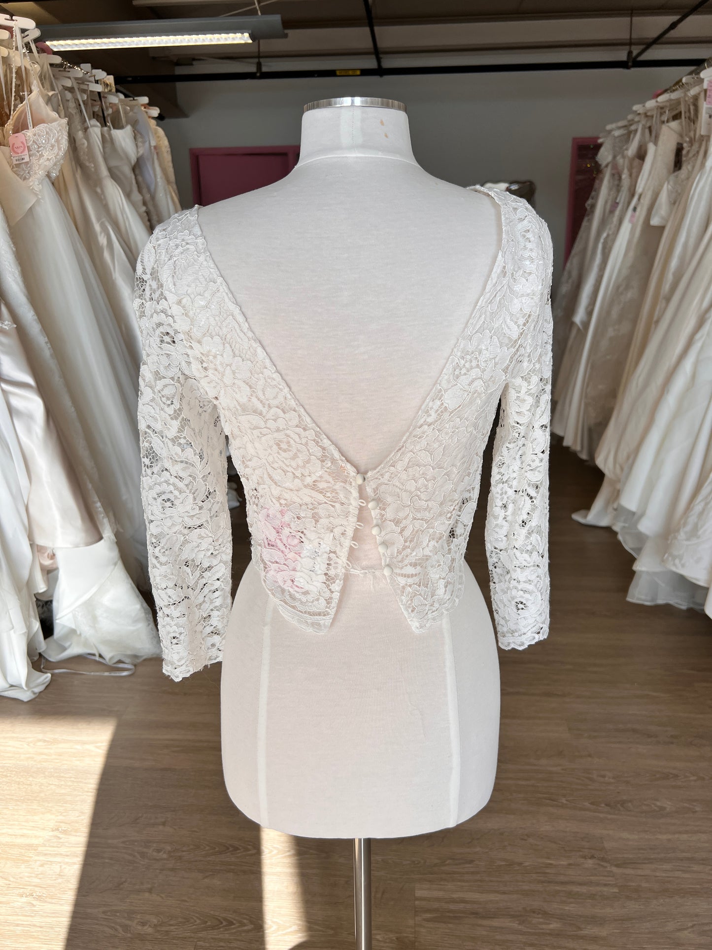 White lace dress topper, rose vintage lace on a mannequin with a v-back and 4 matching satin buttons.