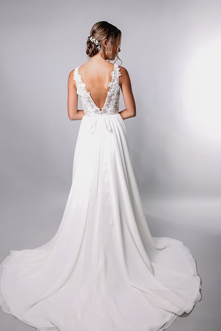 Shauna's a-line silhouette has a soft crepe skirt, artistic lace top and seamless side slit - full body back view