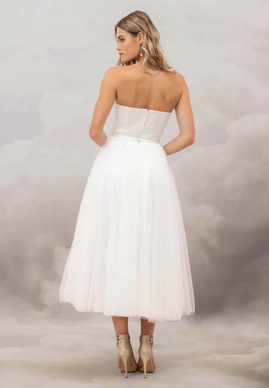Add a touch of whimsy to your wedding day look with the fun and flirtatious Talulla skirt. This midi length, soft tulle skirt features a silk satin waistband.