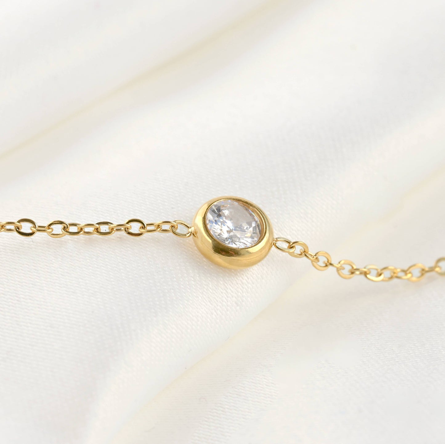 Close up of bezel necklace gold crystal