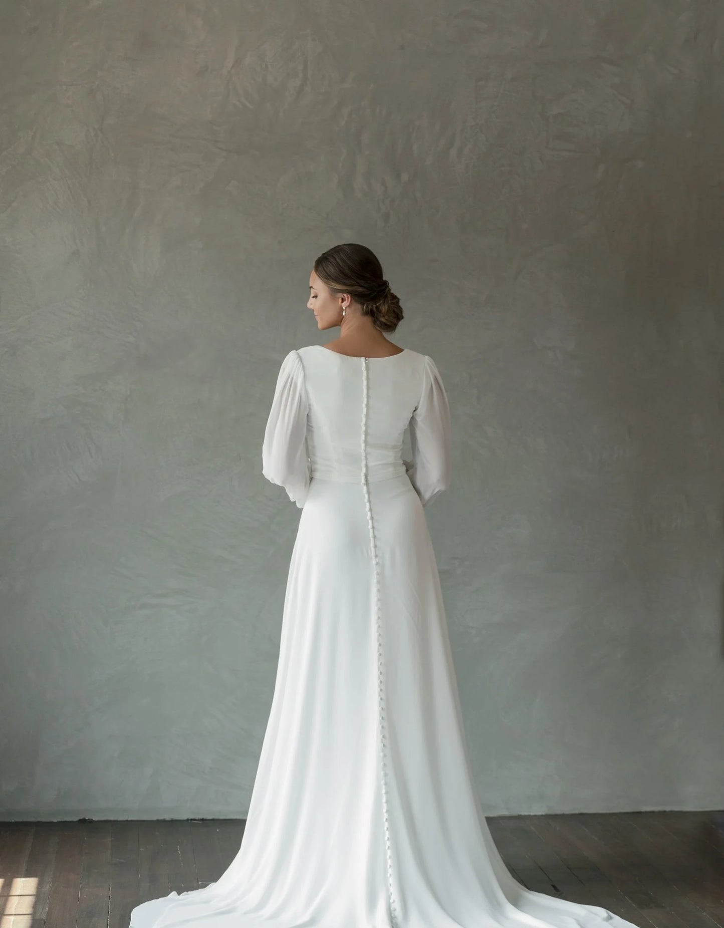 Full body back view of Lily by The Modest Bride