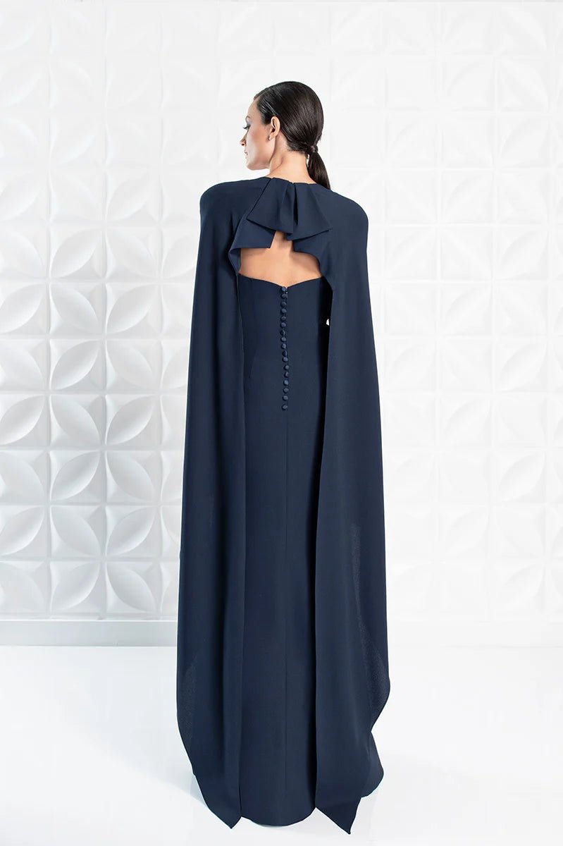 A young woman from the back wearing a navy dress