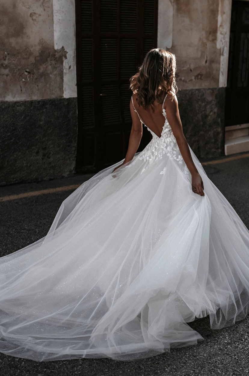 Dana Abella by Allure Bridal on model facing back