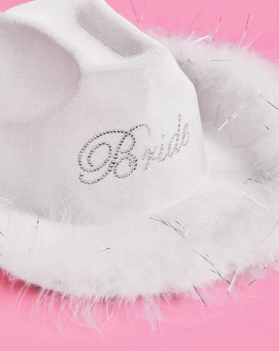white "bride" cowboy hat with a mini veil
