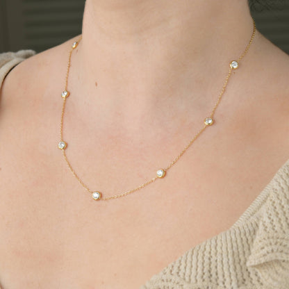 Bezel necklace in a woman's neck