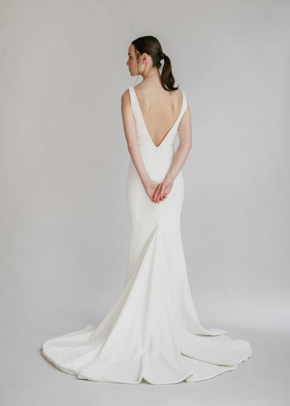 A gorgeous simple v-neck fit and flare gown, with a centre front slit and deep V back - full body back view