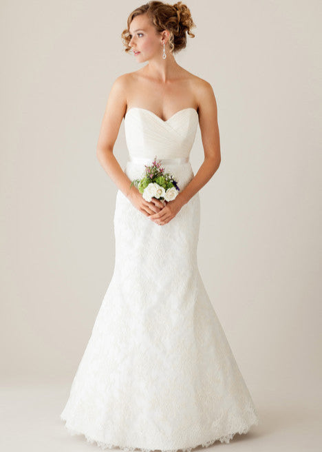 A classic sweetheart mermaid wedding dress with a pleated bodice and gorgeous lace throughout - full body front view
