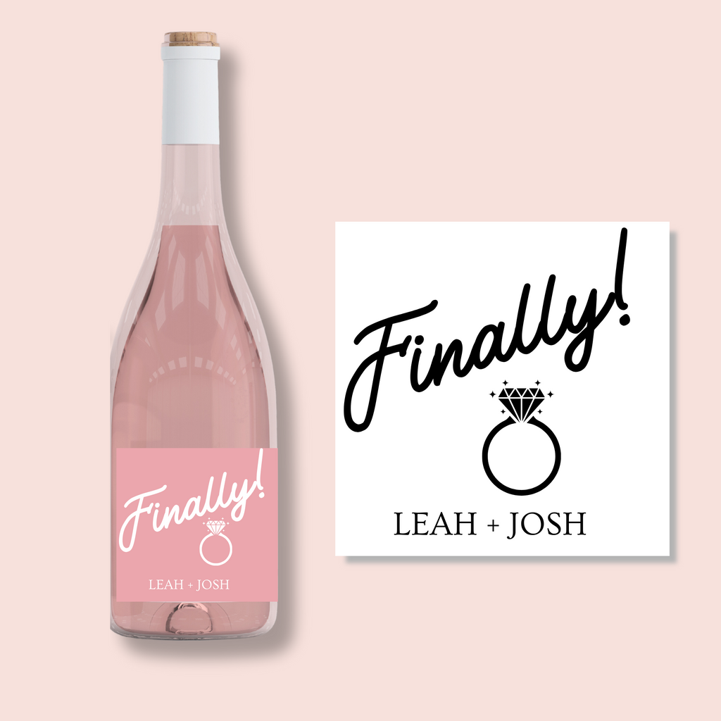 A rose wine bottle with "Finally!  Leah + Josh" written on the label