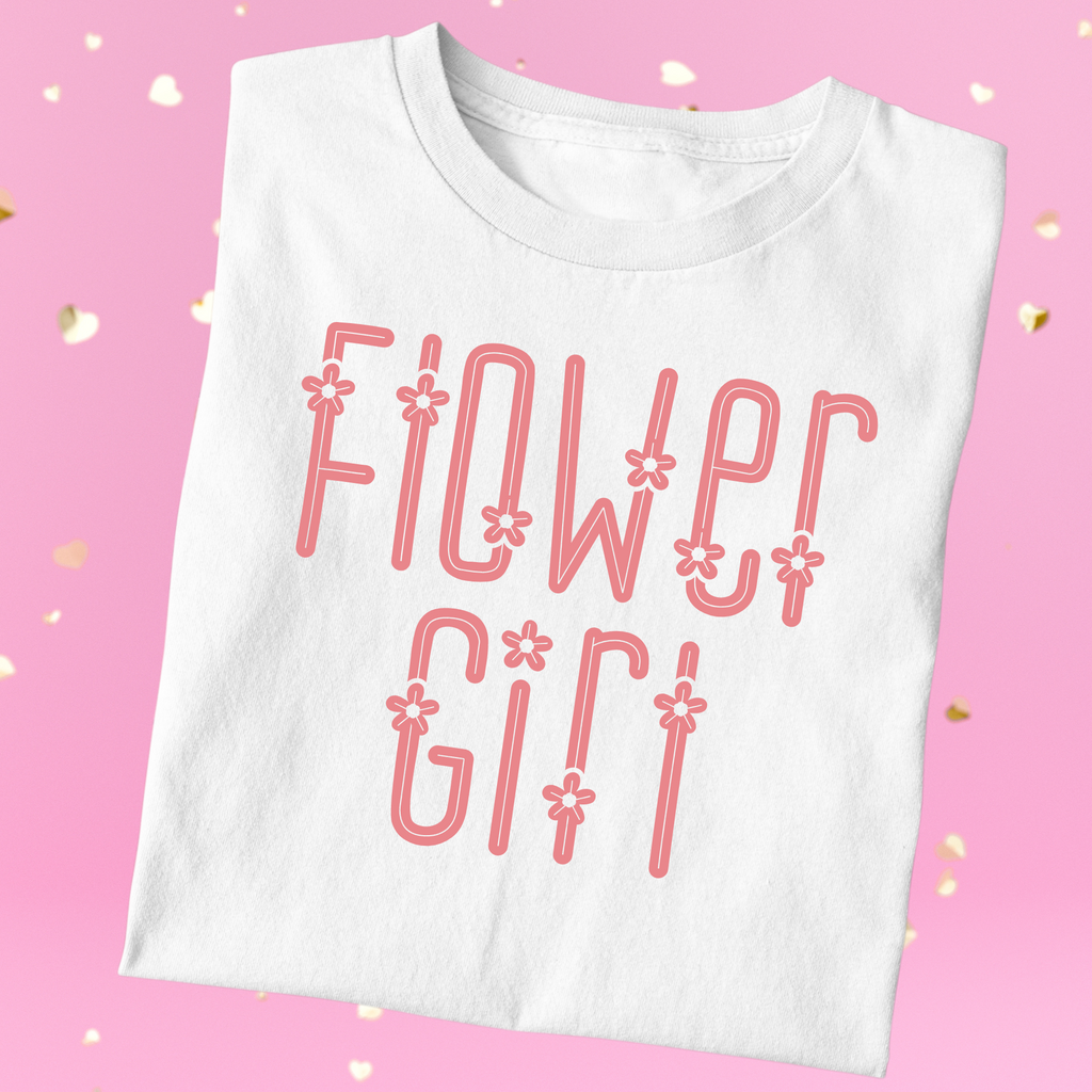 White shirt with "flower girl" written in pinnk