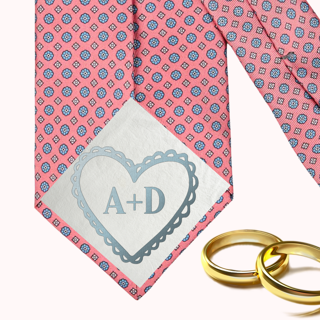 Image of custom tie patch - A+D written in a blue heart on a pink and blue tie patch