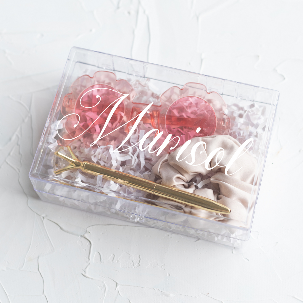 Clear acrylic box with "Marisol" written in white