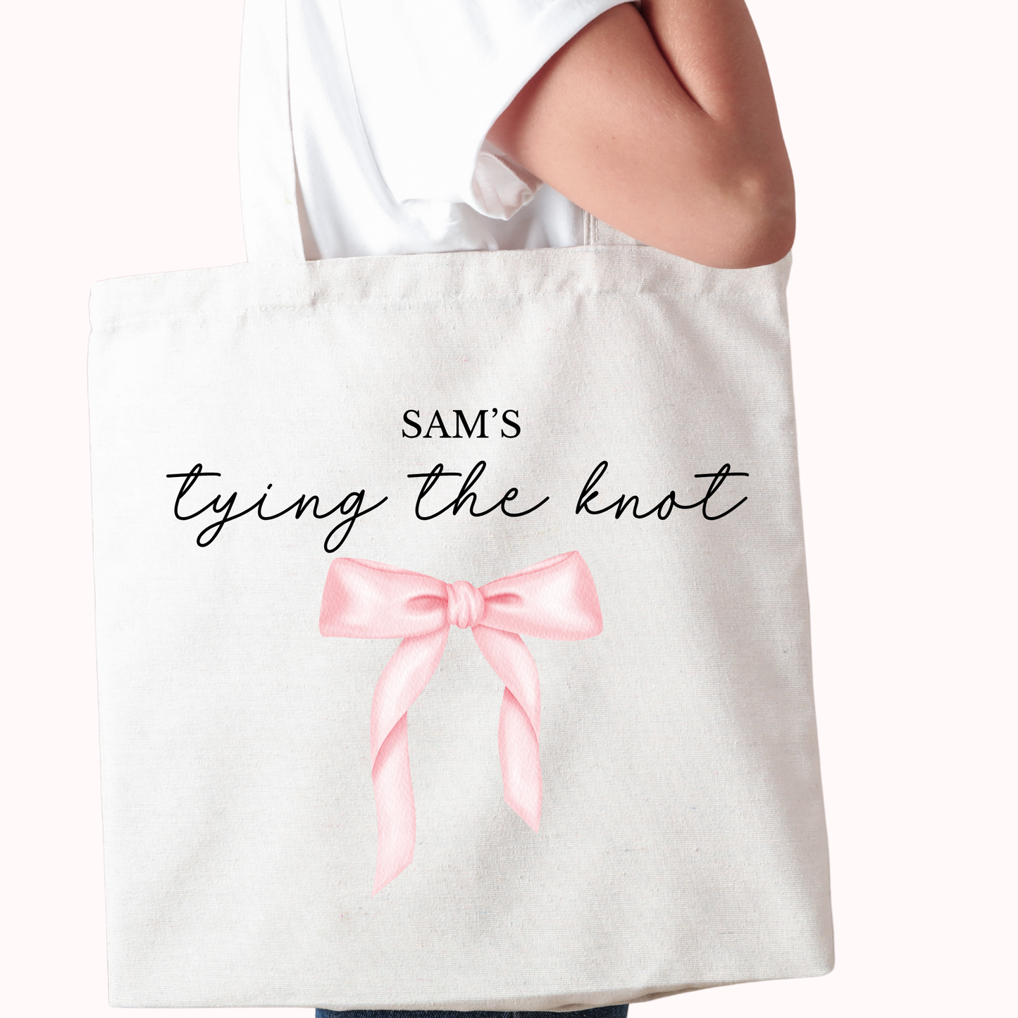 White tote bag with a pink bow