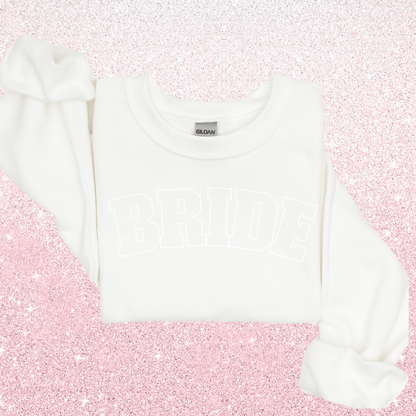 A white sweater with "BRIDE" in white 