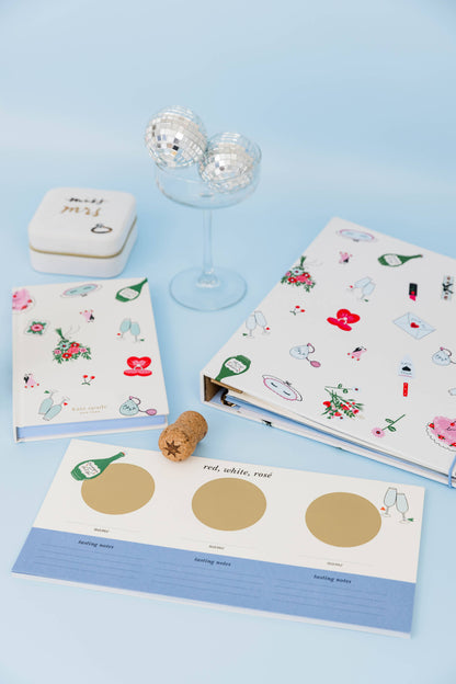 White kate spade notebook with wedding graphics