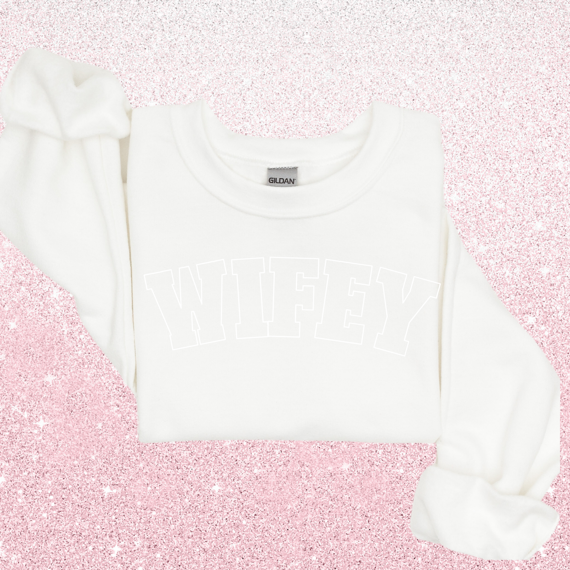 A white sweater with "wifey" written in big block letters
