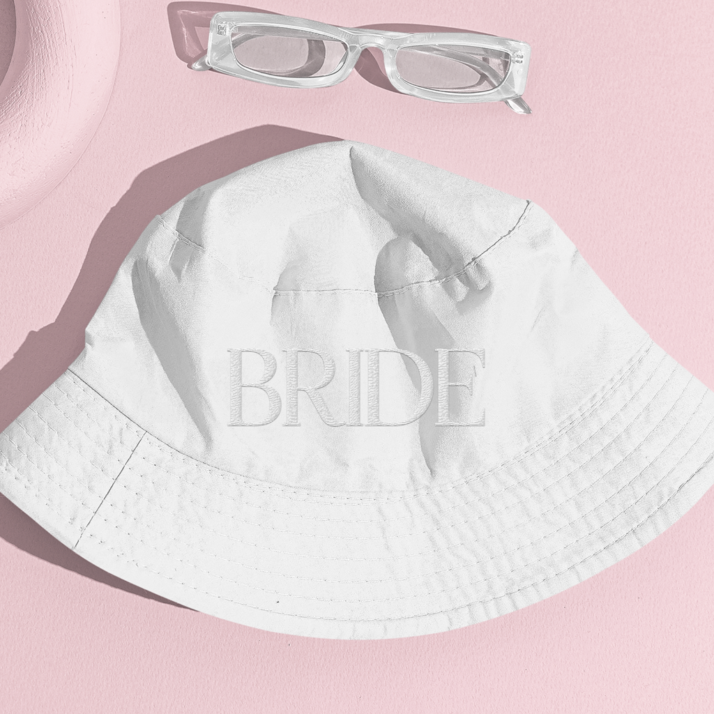 White bucket hat with "BRIDE" embroidered crewneck