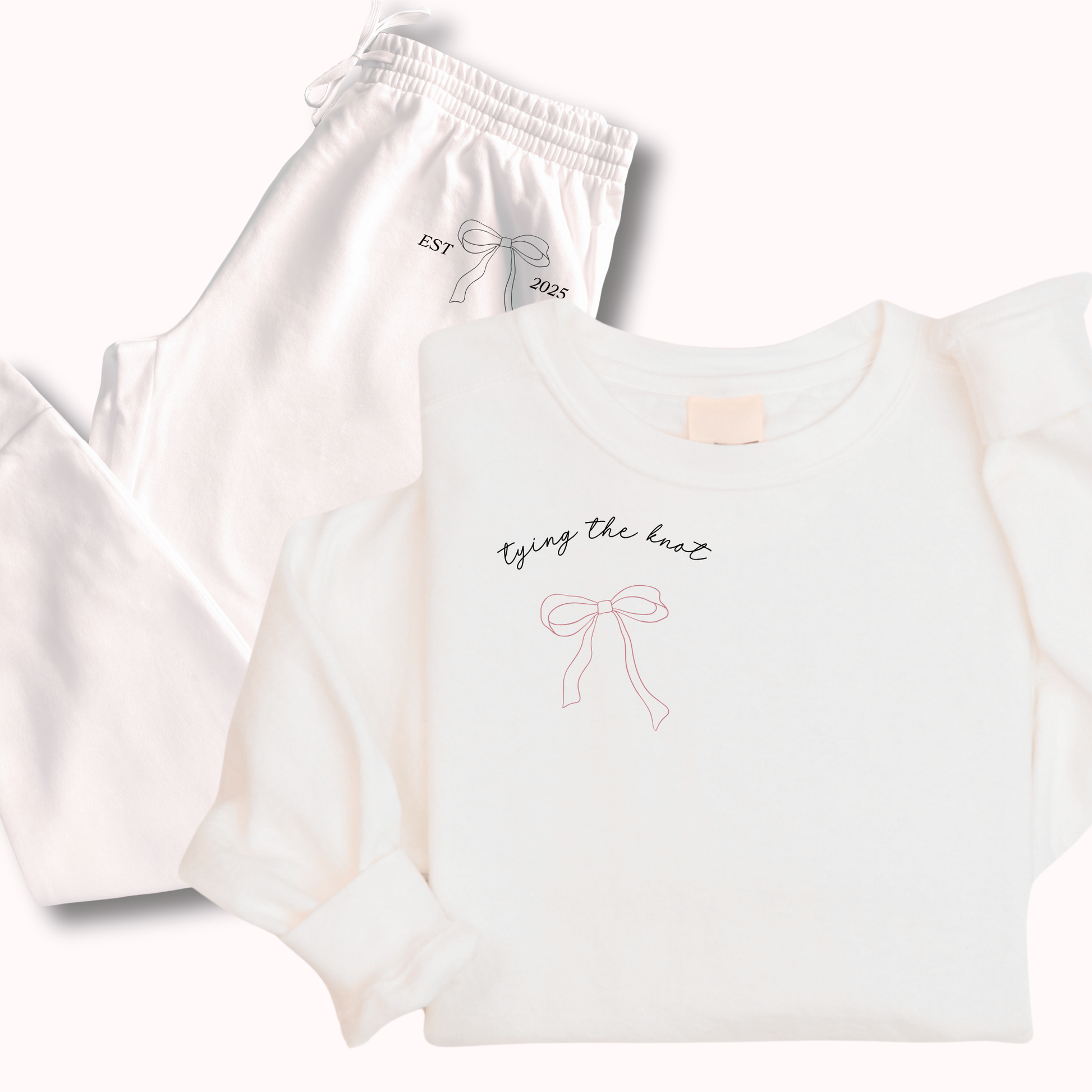 White t-shirt and shorts set with 'tying the knot' text and bow design on a white background.