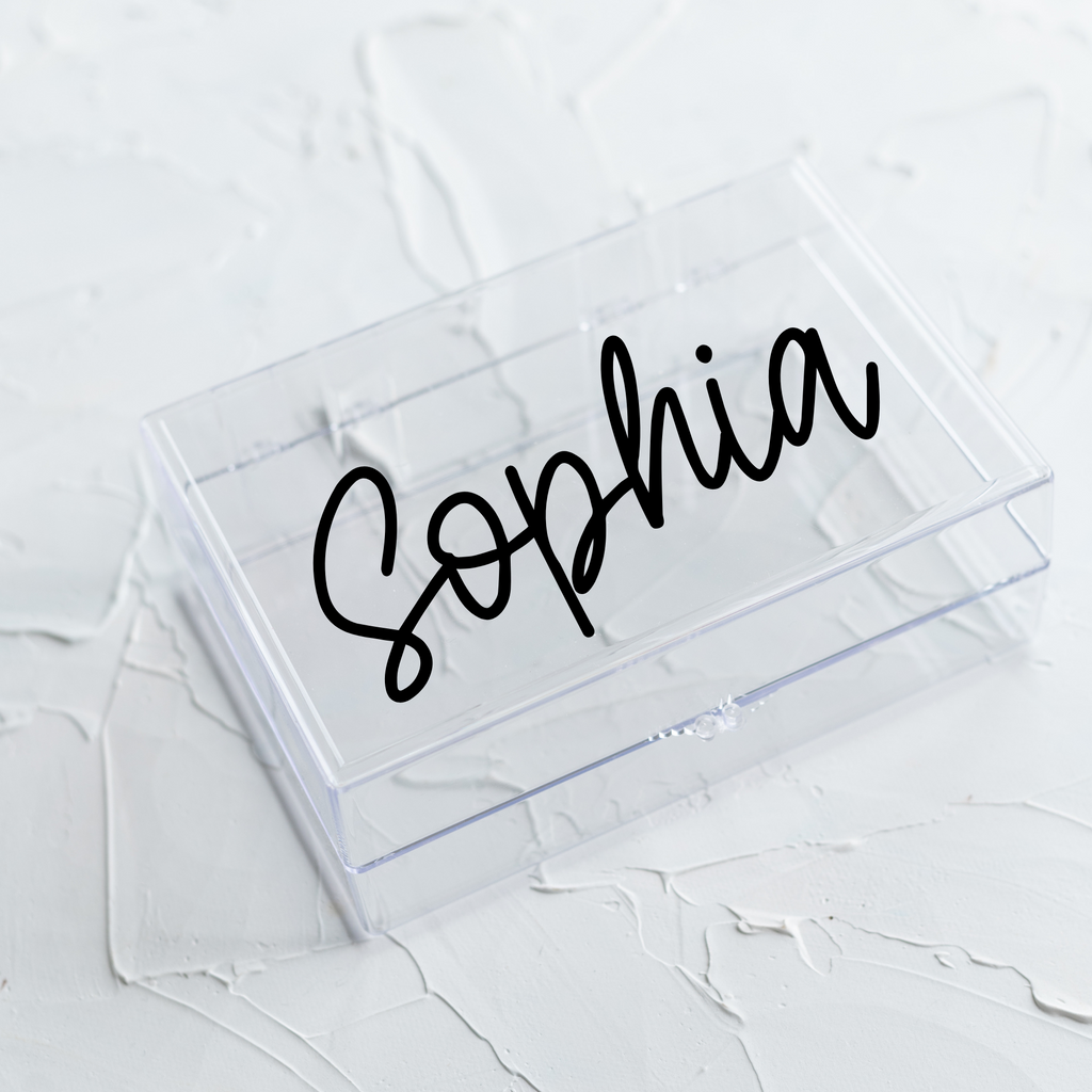 Clear acrylic box with "Sophia" written in black
