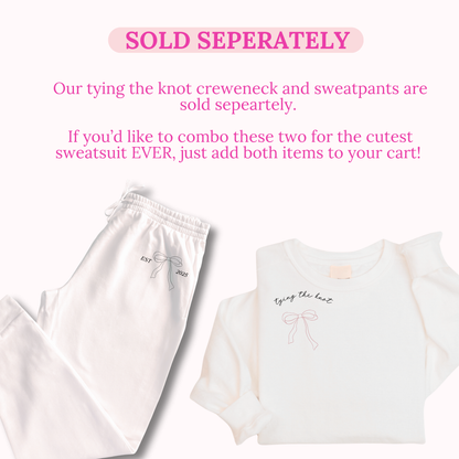 White t-shirt and sweatpants with 'tying the knot' text on a white background