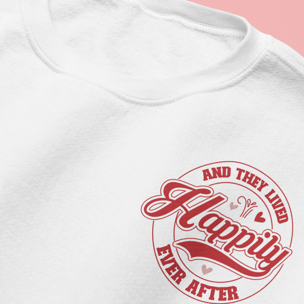 Woman wearing a white crewneck with "and they lived happily ever after" in red