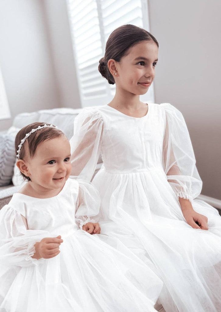 2 young girls wearing the The "Clementine" - Long Sleeve Dress