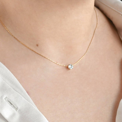 Solitaire necklace on a womens neck