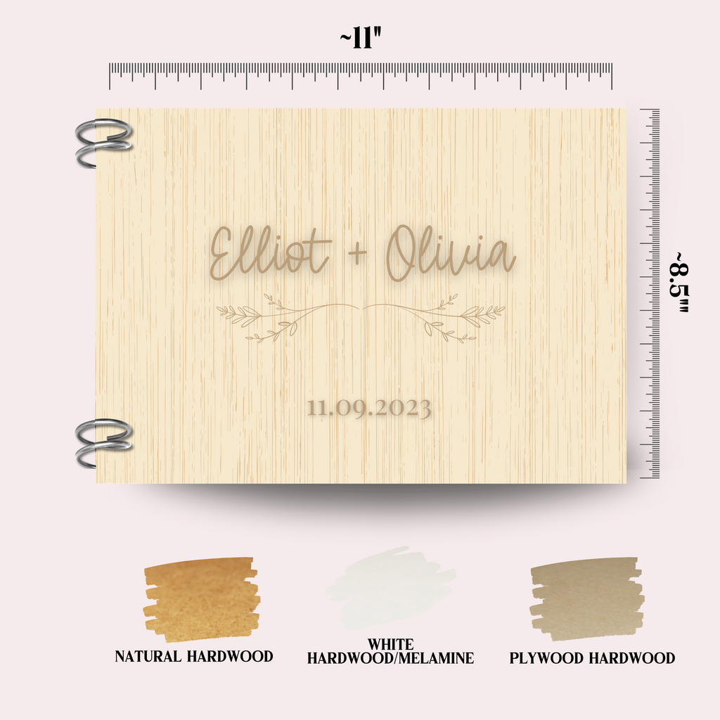 A natural hardwood wedding guest book, with"Elliot + Olivia 11.09.2023" engraved with a delicate floral design. The dimensions, 8.5" x 11" are indicated as well as the book finish options.