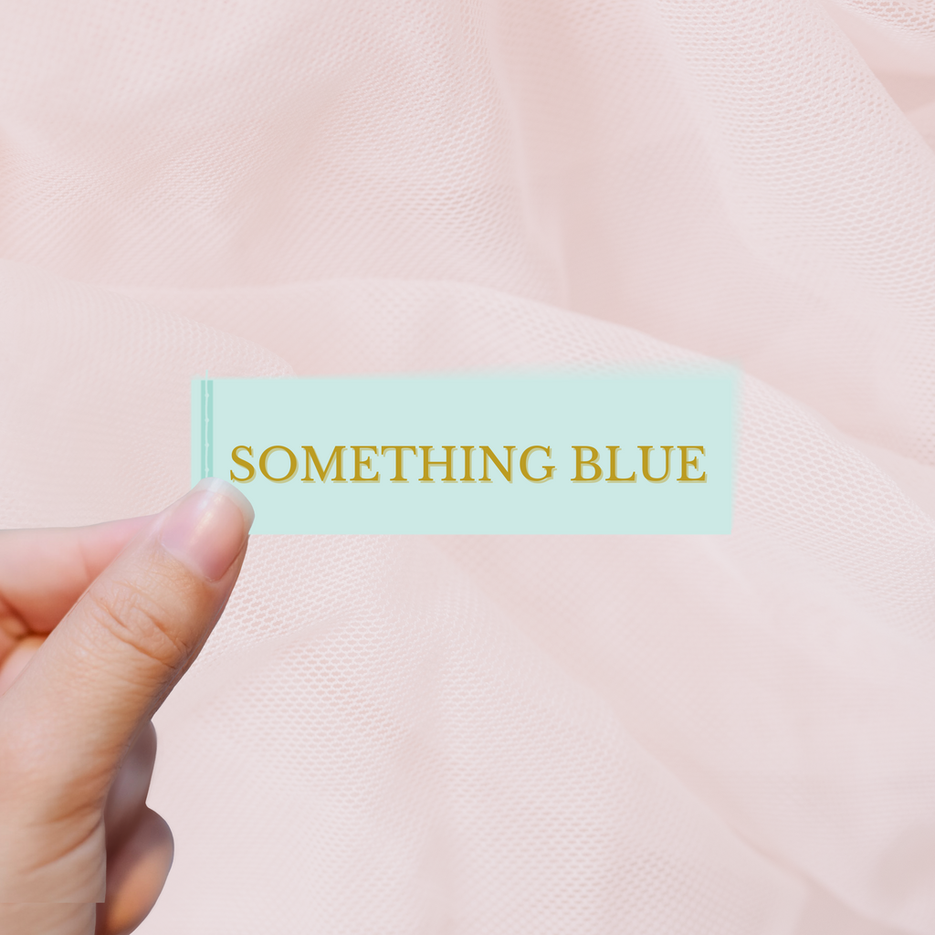 Blue tag with "something blue" written on it in gold