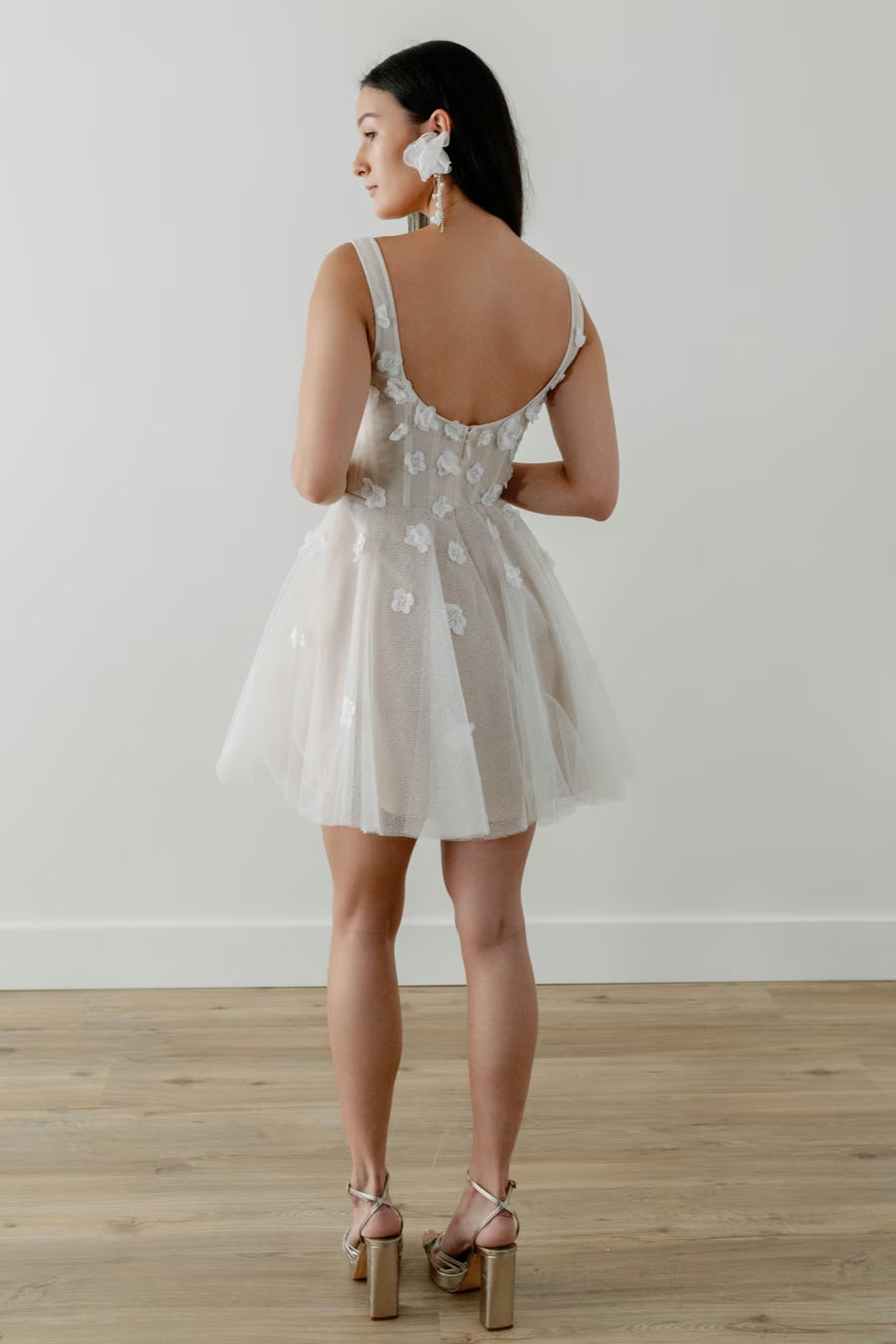 Floral appliques cascade down the corseted tulle bodice and circle skirt. Whether a garden party shower, romantic engagement photos, or dancing the night away after the big day - Jive is a perfect option for any event!