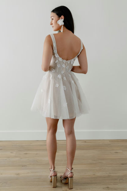 Floral appliques cascade down the corseted tulle bodice and circle skirt. Whether a garden party shower, romantic engagement photos, or dancing the night away after the big day - Jive is a perfect option for any event!