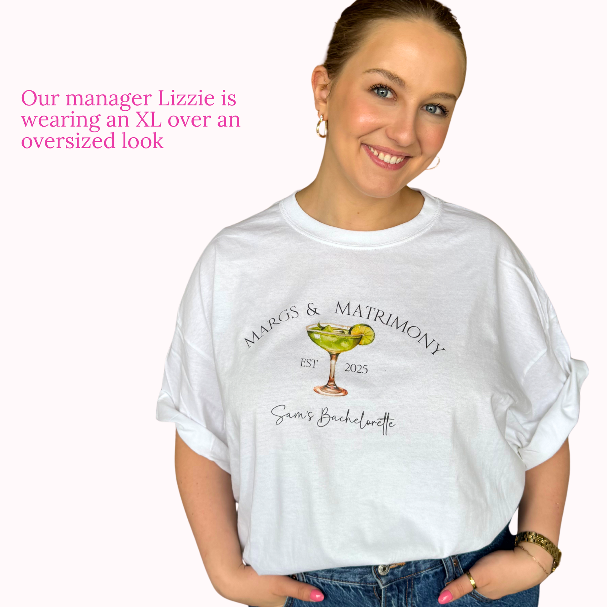 Woman wearing a white t-shirt with a graphic design and text, standing against a plain background.