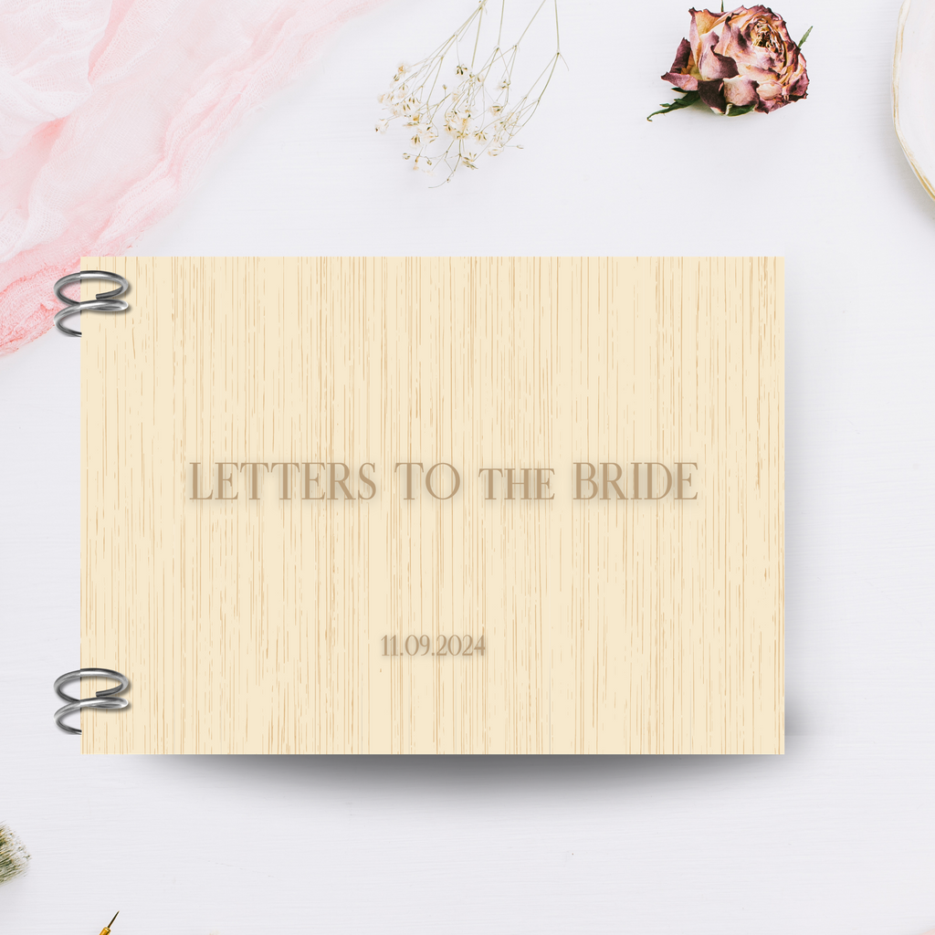 Light wooden book that says "letters to the bride 11.09.2024"
