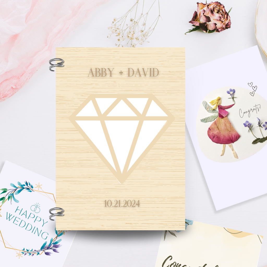 Wooden notebook with "abby + david, 10.21.2024"engraved with a diamond cut out