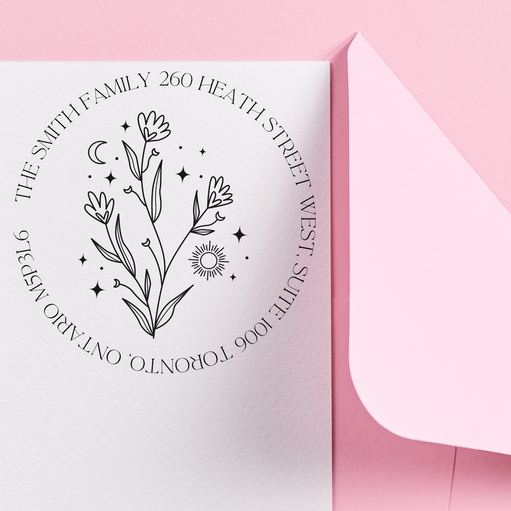 The Smith Family custom stamp with a celestial bouquet on a white envelope with a pink background
