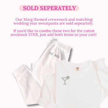 White t-shirt and sweatpants with 'EST 2023' and martini glass design on a white background.