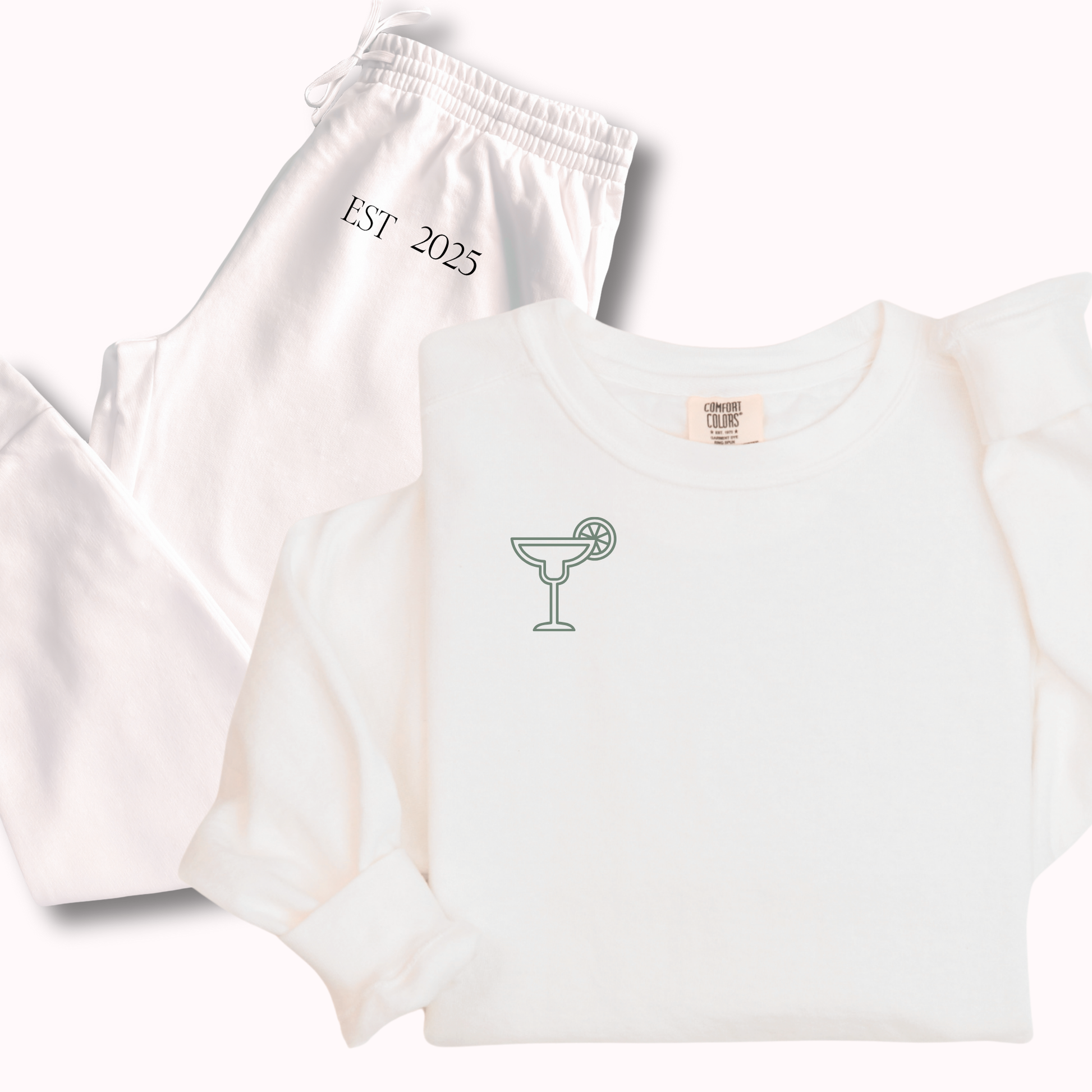 White t-shirt and shorts set with 'EST 2025' text on a white background