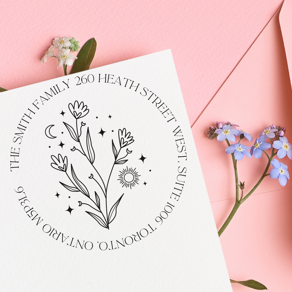 The Smith Family custom stamp with a celestial bouquet on a white envelope with a pink background