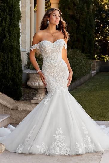 mermaid nweetheart wedding dress with lace down the bodice, off the shoulder sleeves and a tulle skirt & train. Available at Never Knew I Needed