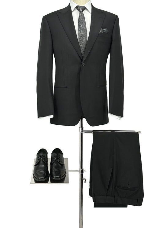 Black suit with tie, shoes, and pants on a white background