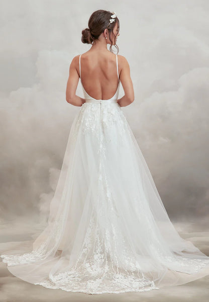 Woman wearing the begonia detachable skirt for wedding dresses