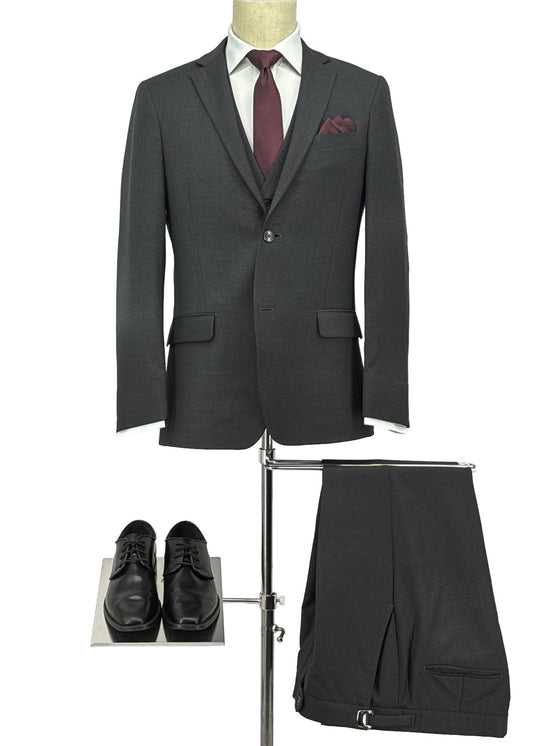 Gray suit with a red tie, pocket square, and shoes on a white background