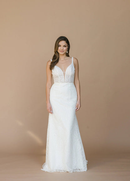 Lace overlay illusion V-neck, ultra-low illusion V-back with straps, fit to flare with illusion court train, zip closure.