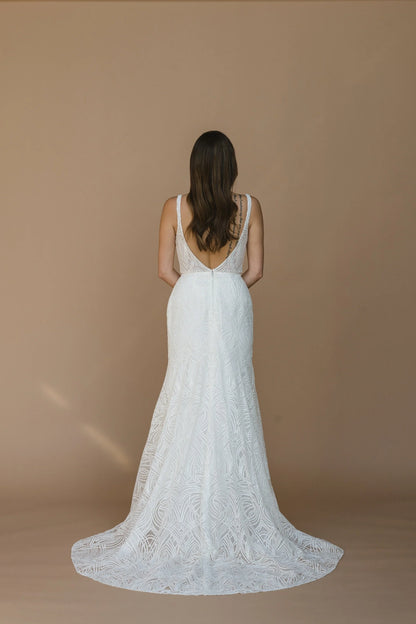 Lace overlay illusion V-neck, ultra-low illusion V-back with straps, fit to flare with illusion court train, zip closure.