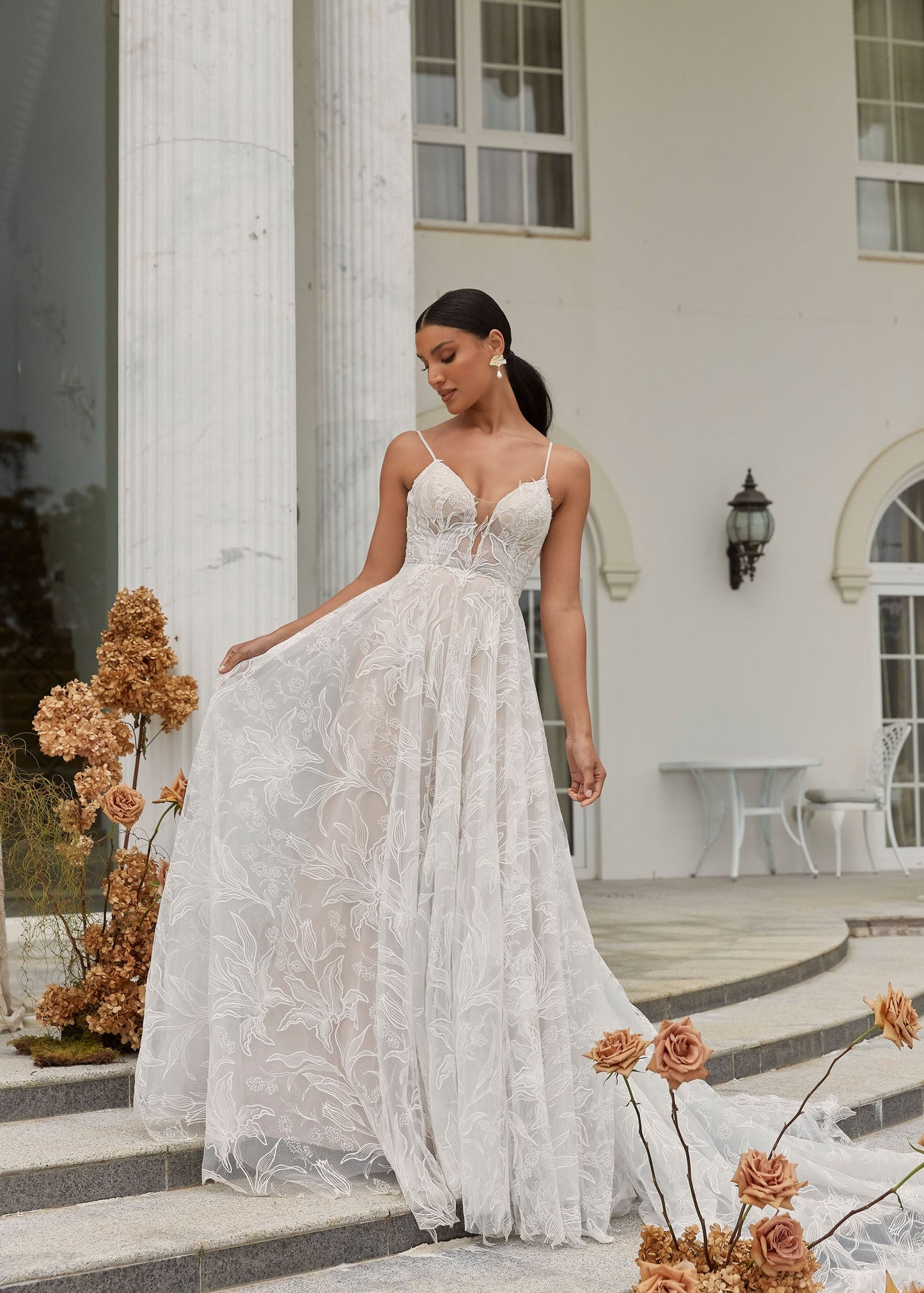 FULL BODY VIEW OF DUNE, A BOHO INSPIRED A LINE WITH DELICATE STRAPS AND A PLUNGING V NECK