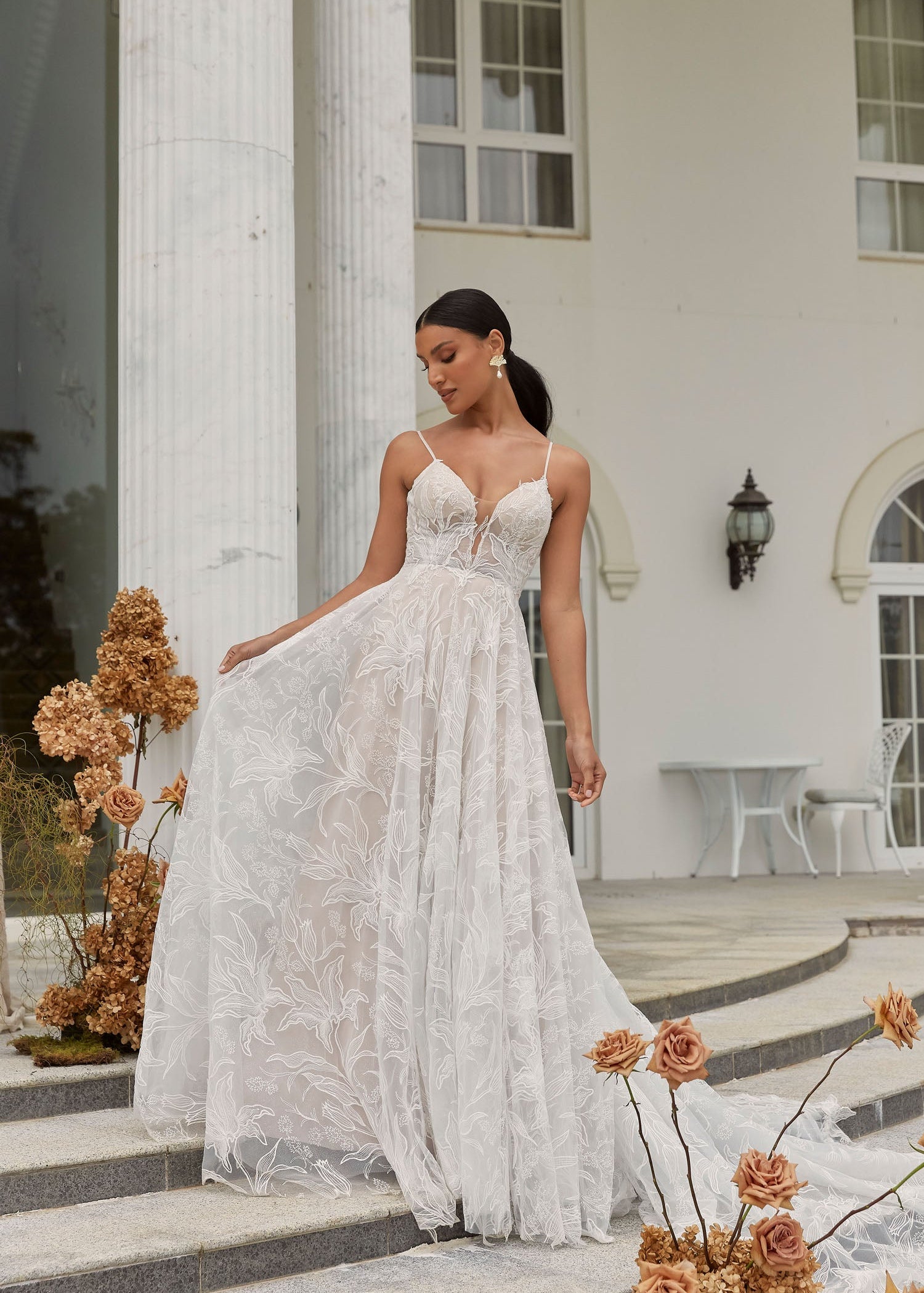 FULL BODY VIEW OF DUNE, A BOHO INSPIRED A LINE WITH DELICATE STRAPS AND A PLUNGING V NECK