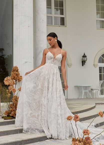 FULL BODY VIEW OF DUNE, A BOHO INSPIRED A LINE WITH DELICATE STRAPS AND A PLUNGING V NECK